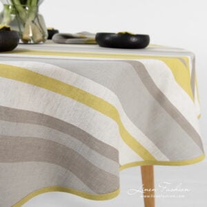 Linen round oval tablecloth striped with piping.