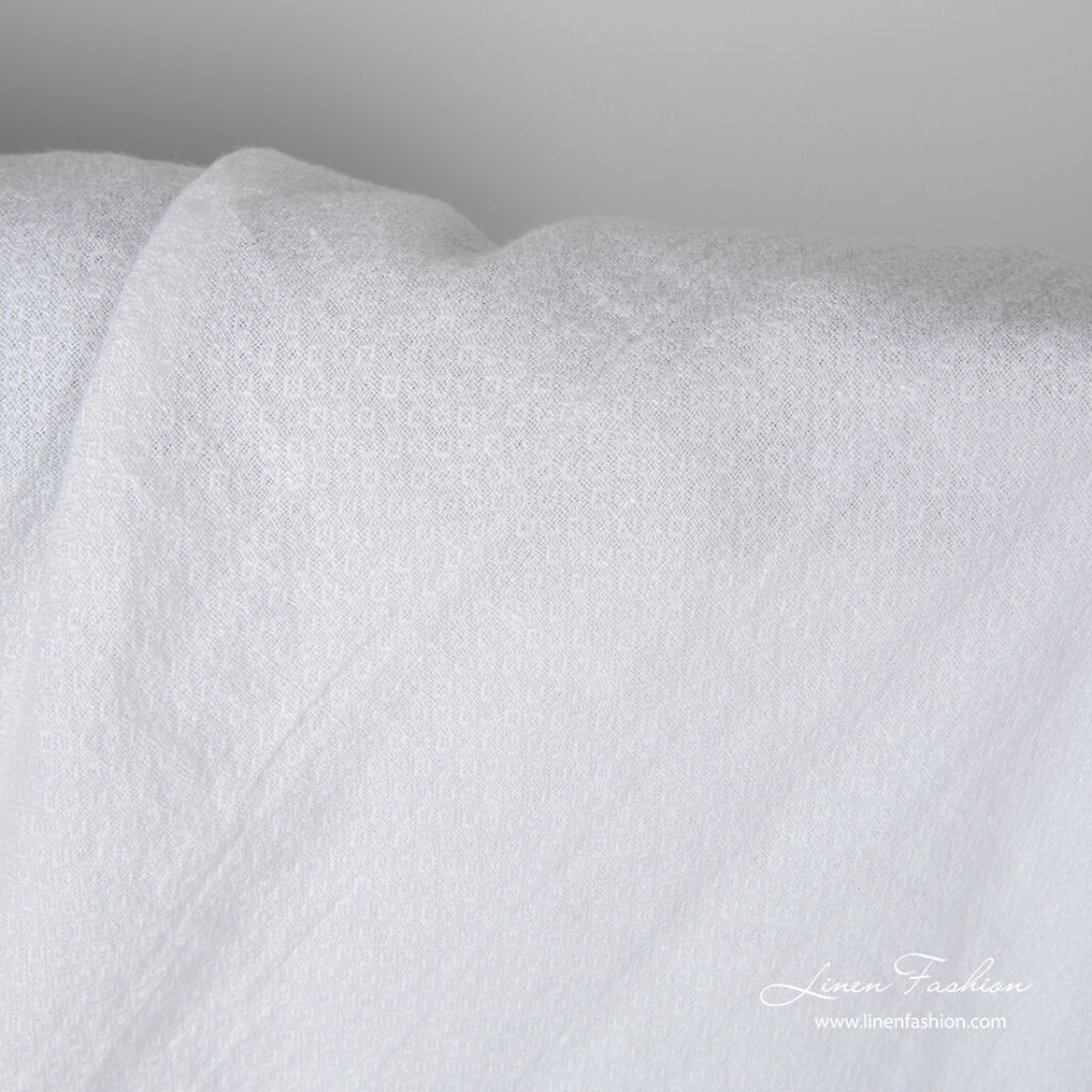 Snow white linen fabric with small square pattern, washed
