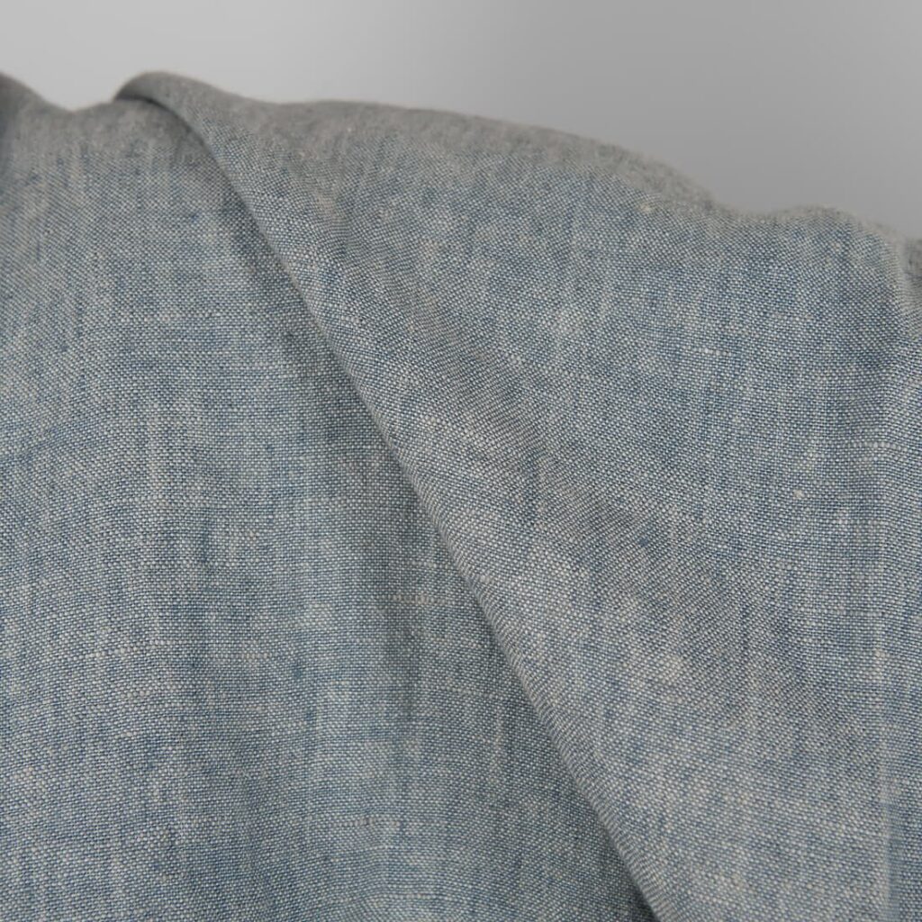 Linen washed fabric grayish blue color for sewing clothes and home textiles close view