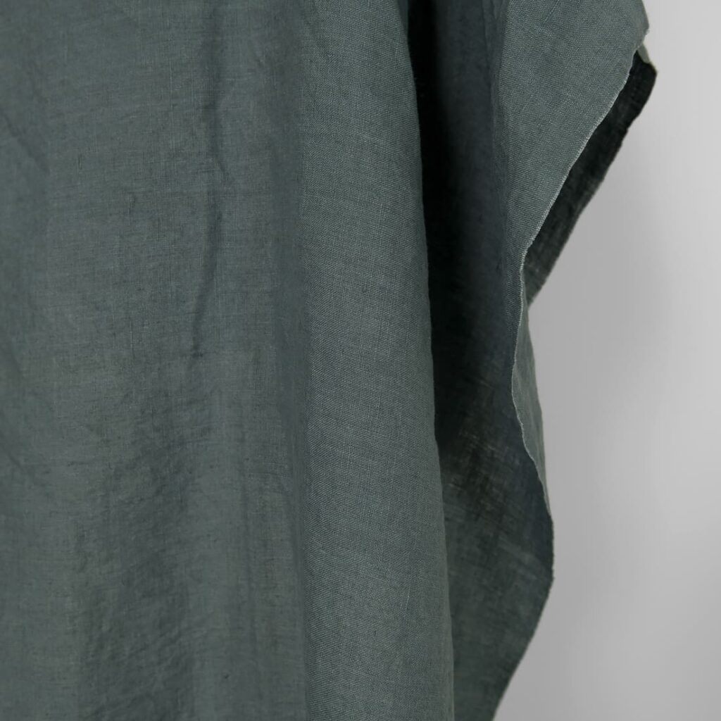 Washed linen fabric in balsam green colour, plain weave
