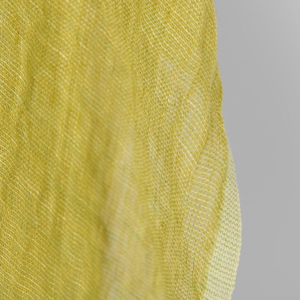 Washed linen fabric yellow green transparent, fabric edge