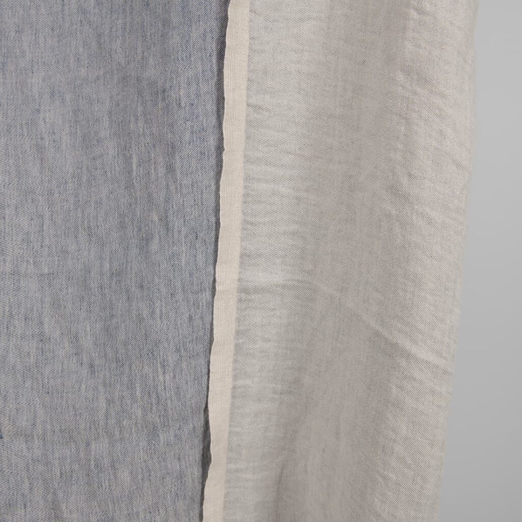 Washed linen fabric blueish grey colour double-sided edge view