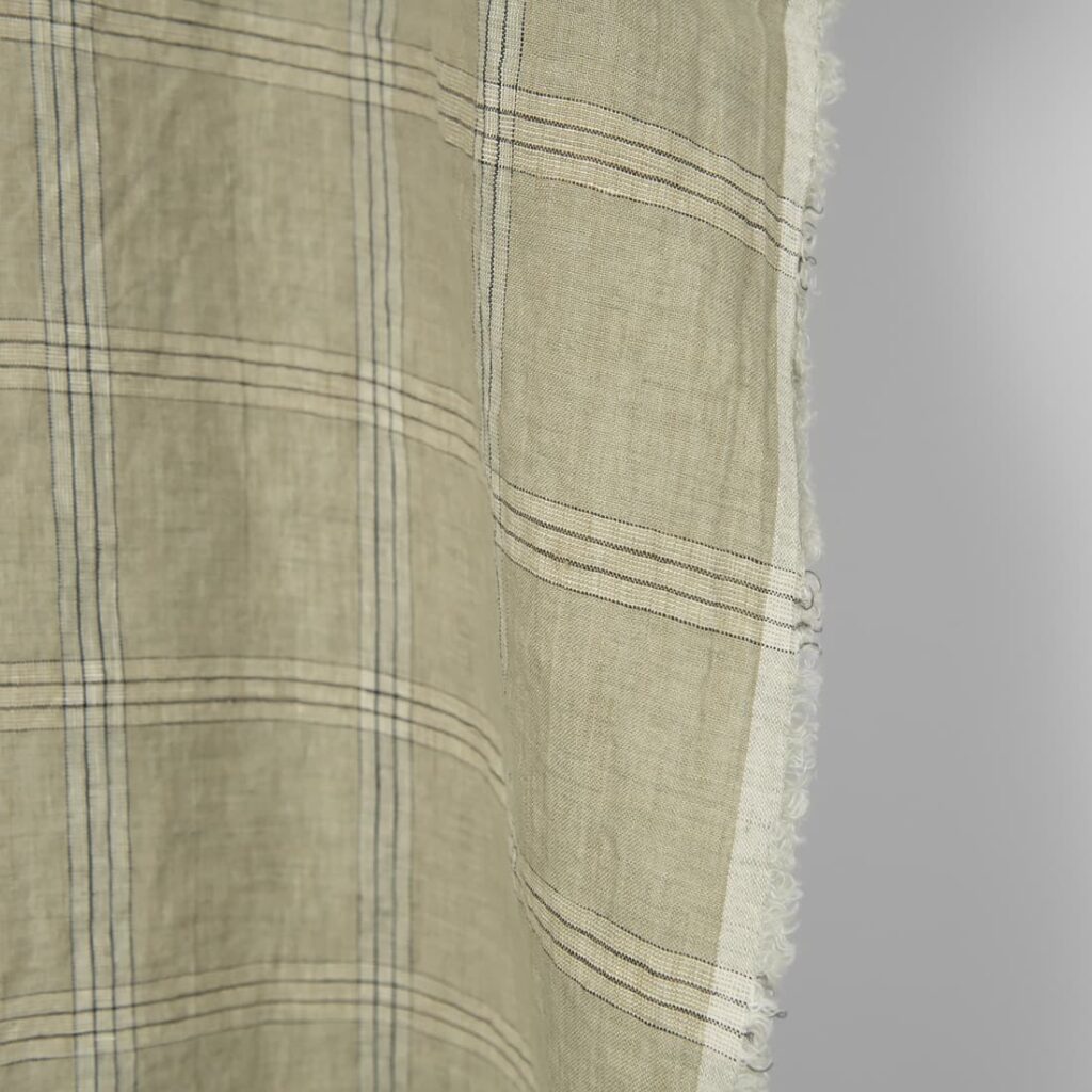 Washed linen fabric green-beige checks, fabric edge