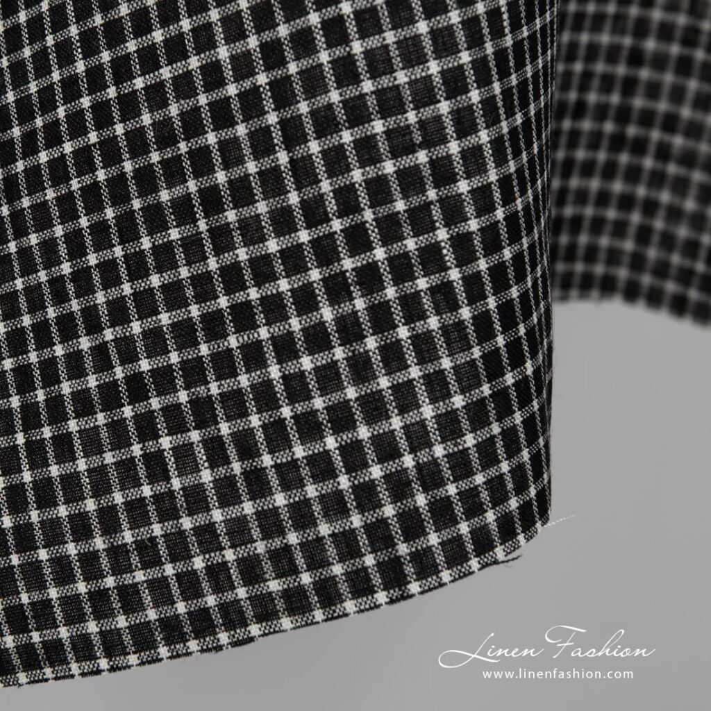 Black linen fabric with white checks close up detail view