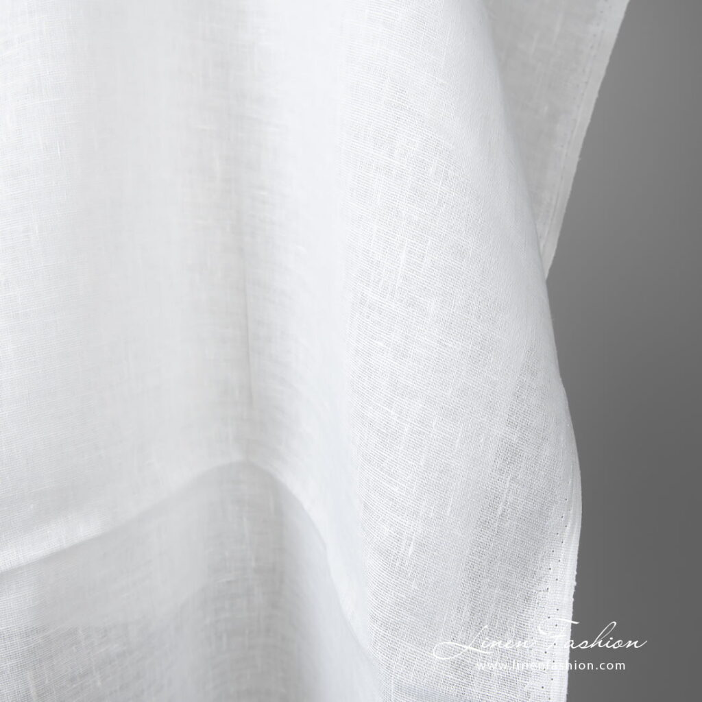 Lightweight linen fabric bright white colour edge view