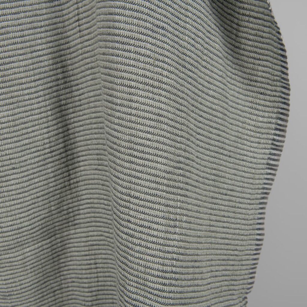 Washed linen fabric green-grey small pattern edge