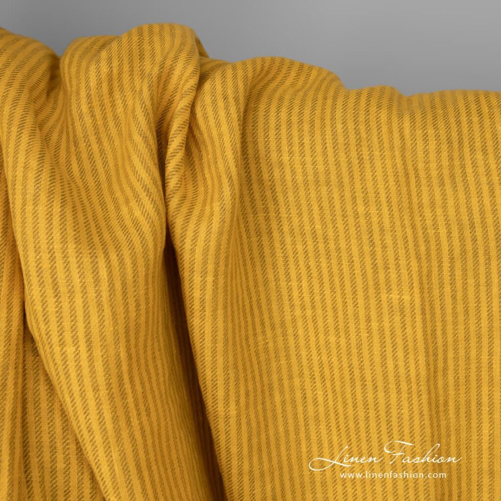 Washed linen fabric yellow colour striped close up detail