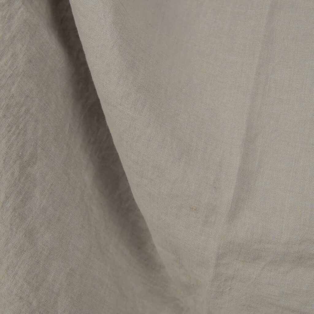 Washed linen fabric cool grey beige colour close up detail