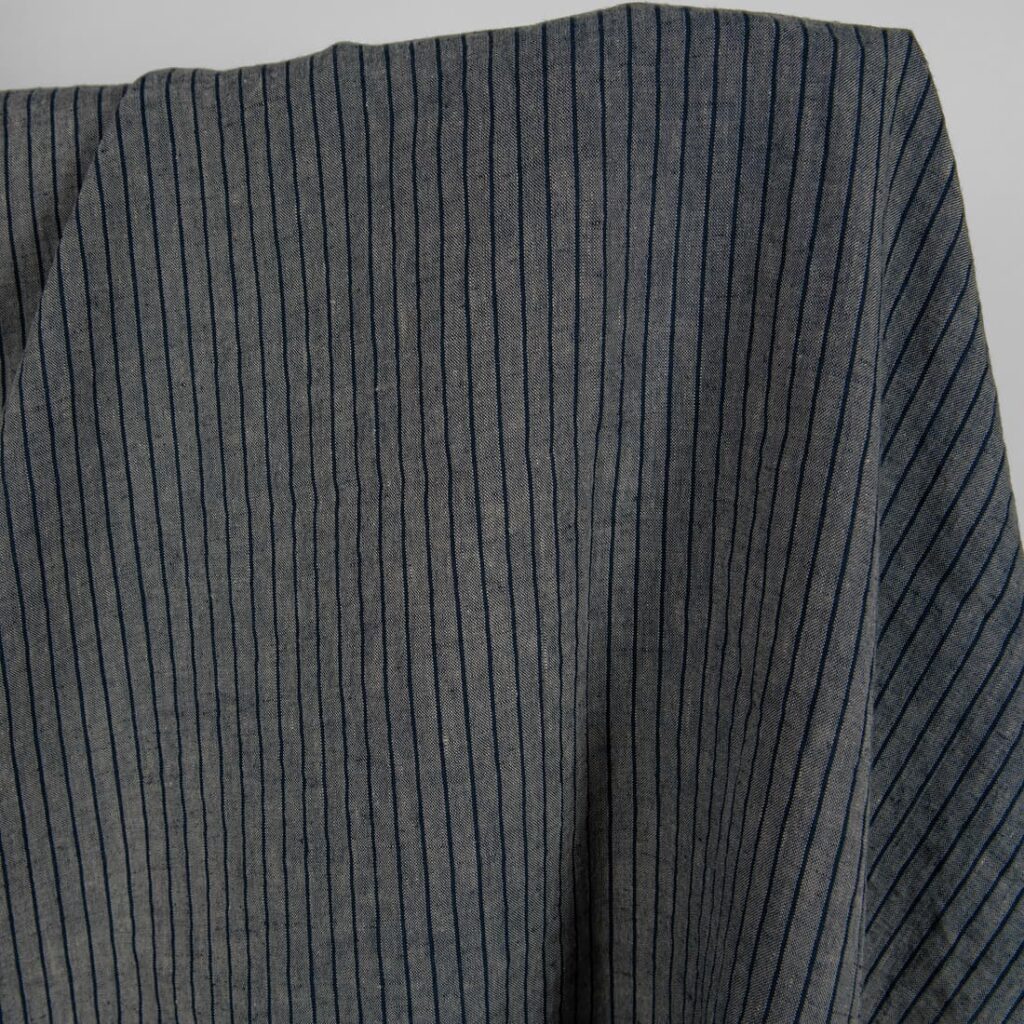 Washed linen fabric grey with thin black stripes product photo