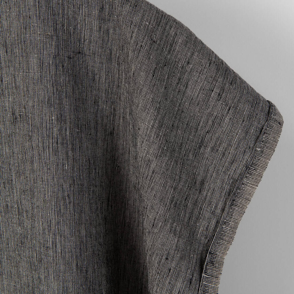 Linen fabric in natural and black, fabric edge