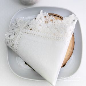 100% linen napkin in white, hole patterned.