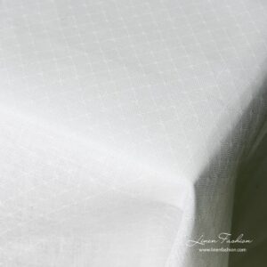 White colored linen tablecloth, white.