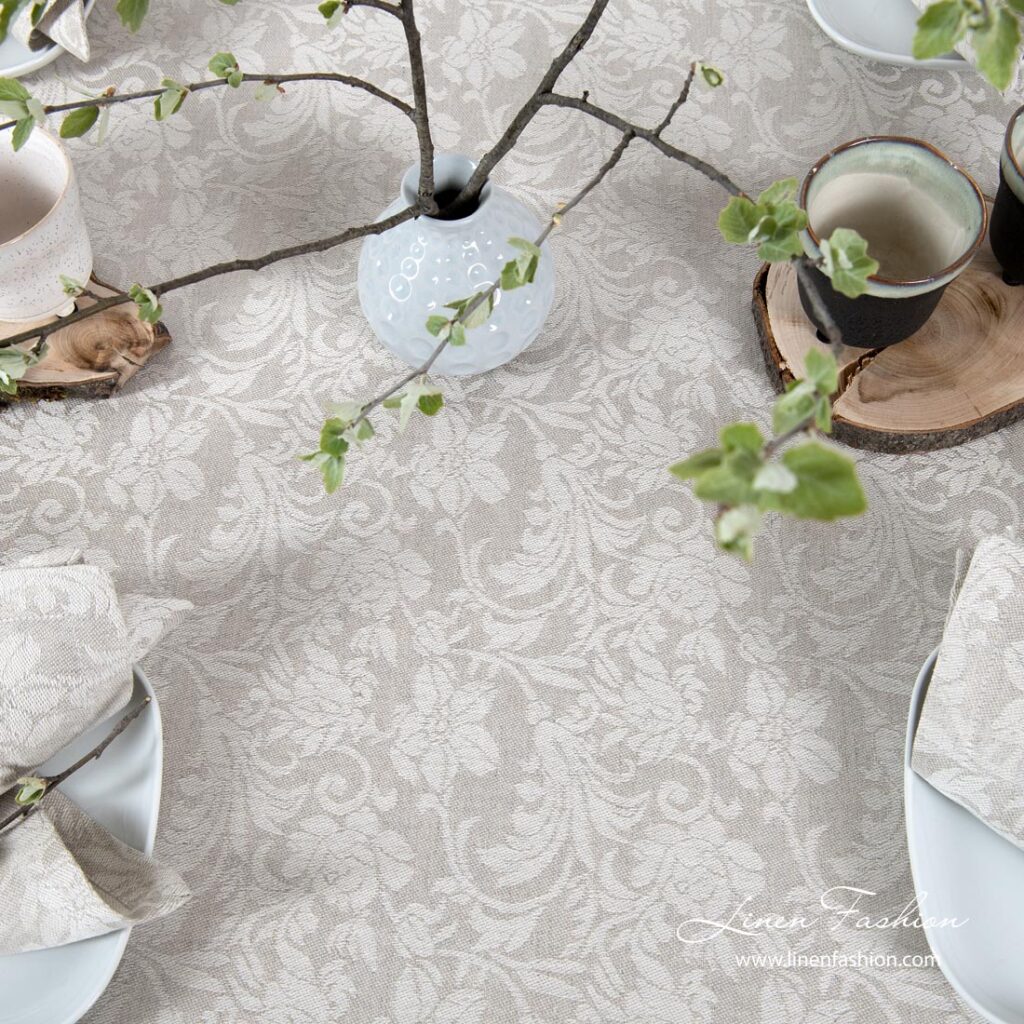 Tablecloth made from light grey and white jacquard linen / cotton fabric in floral motives
