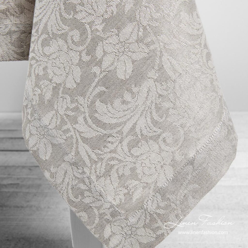 Grey linen tablecloth with flower ornaments, folded border