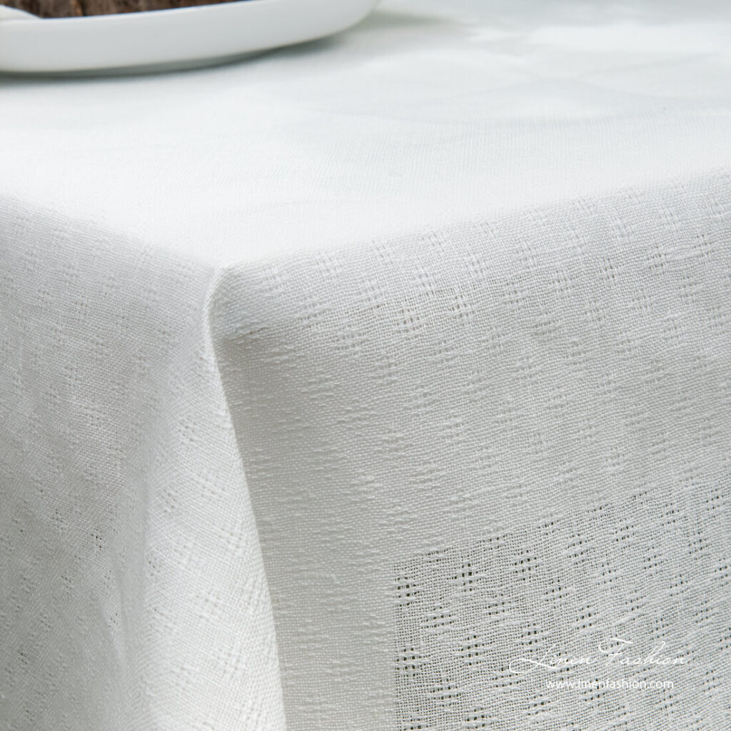 White linen cotton tablecloth with open weave pattern