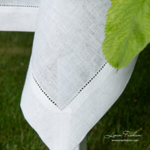 4 cm folded border of hemstitched linen tablecloth