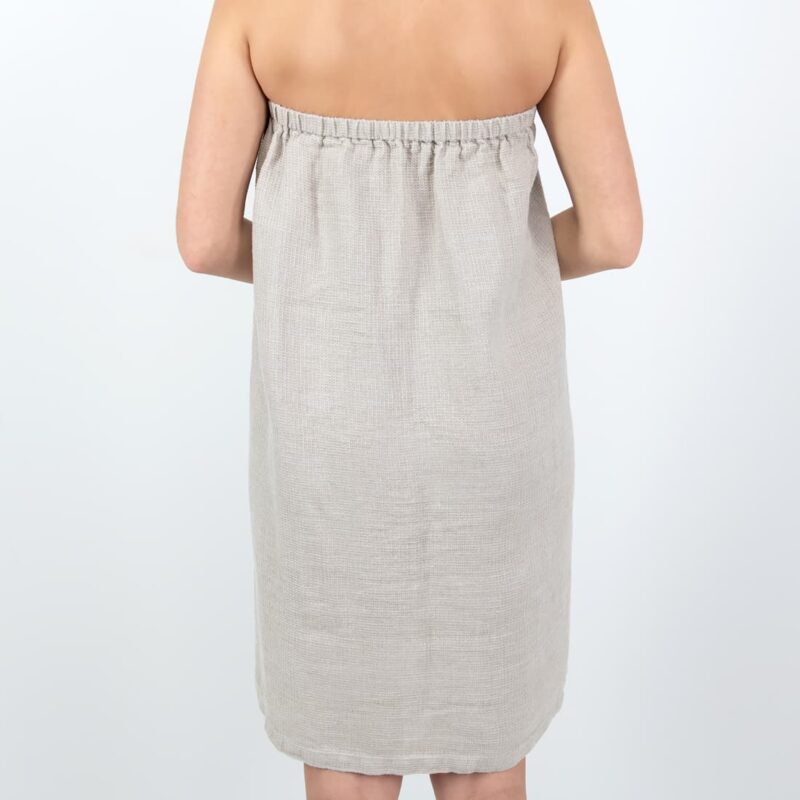 Grey towel with a button from backside