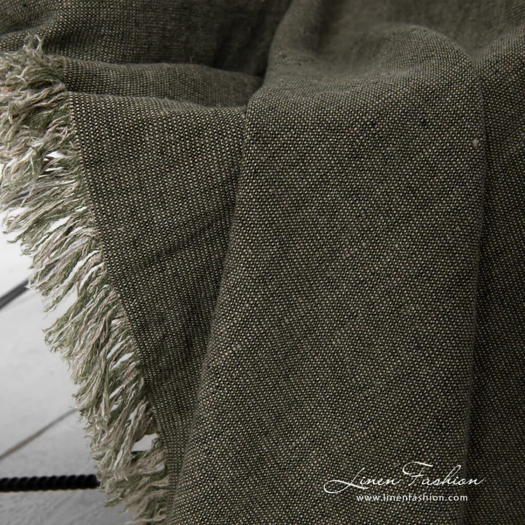 Green linen blanket with loose fringes