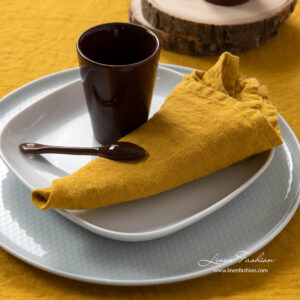Washed linen napkin in mustard color