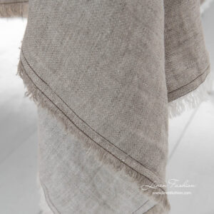 Washed linen tablecloth with white and grey fringes