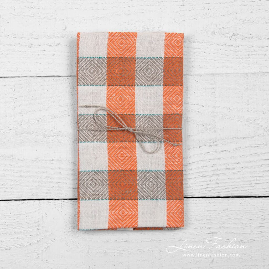 Linen kitchen towel in check and rhombuses pattern