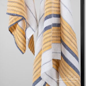 bath towel white with stripes in blue and yellow.