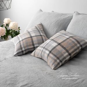 Grey colored linen cushion cover.