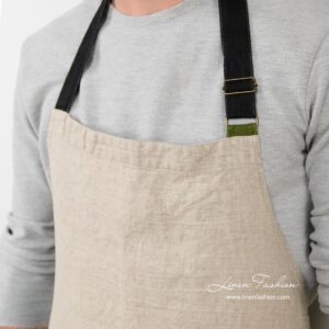 Grey colored apron of linen fabric.