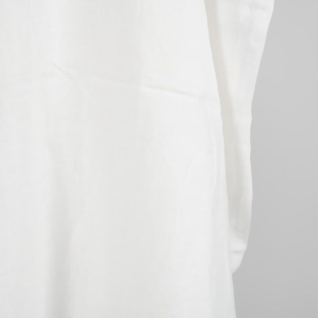 Washed linen fabric in off-white edge