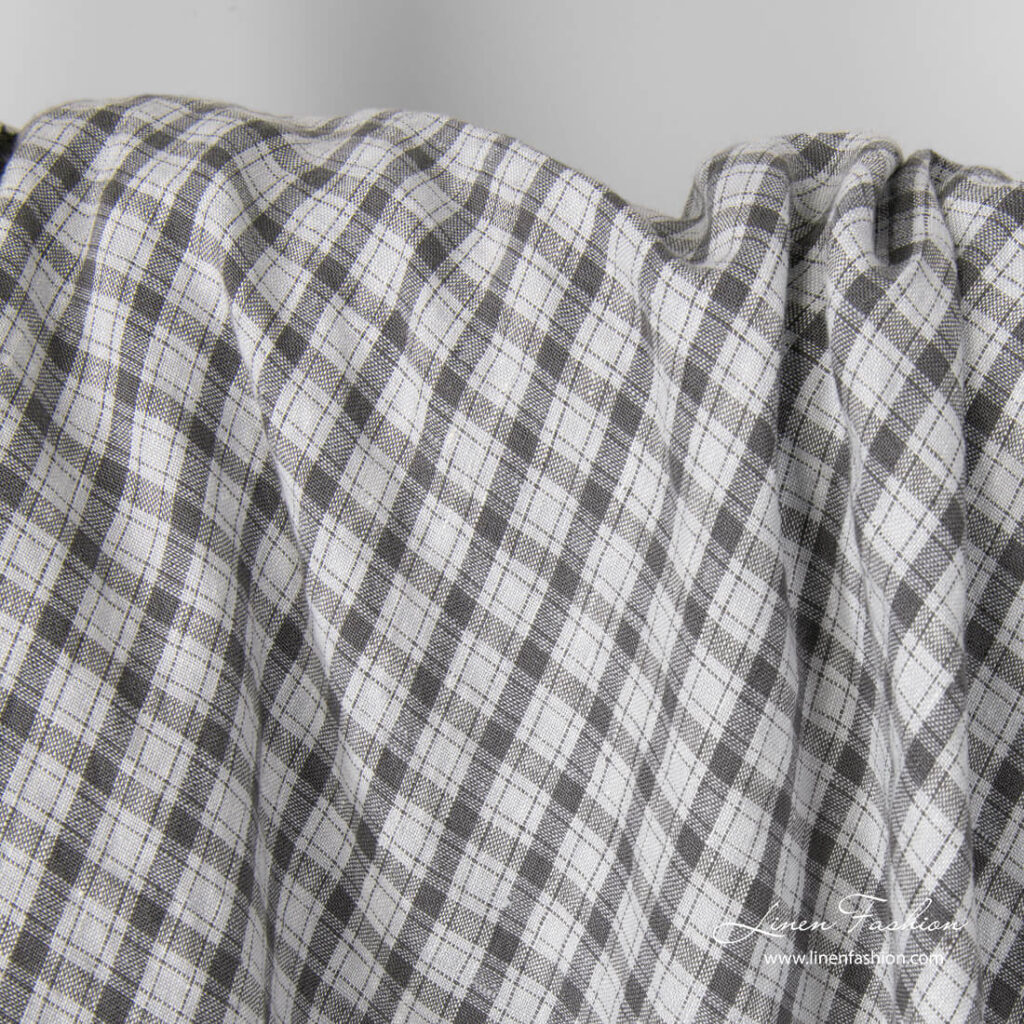 Light grey linen fabric with dark grey checks, washed