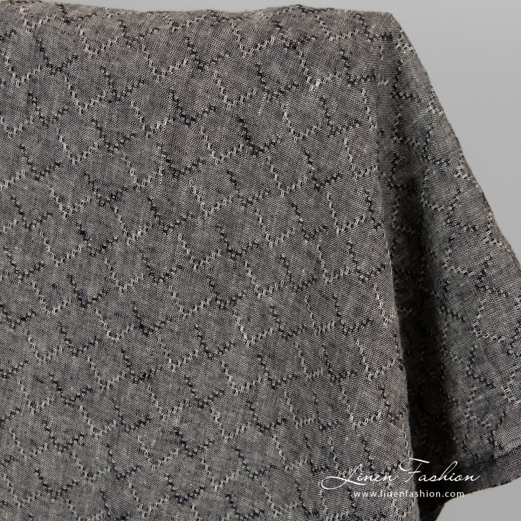 Washed linen fabric in black colour.