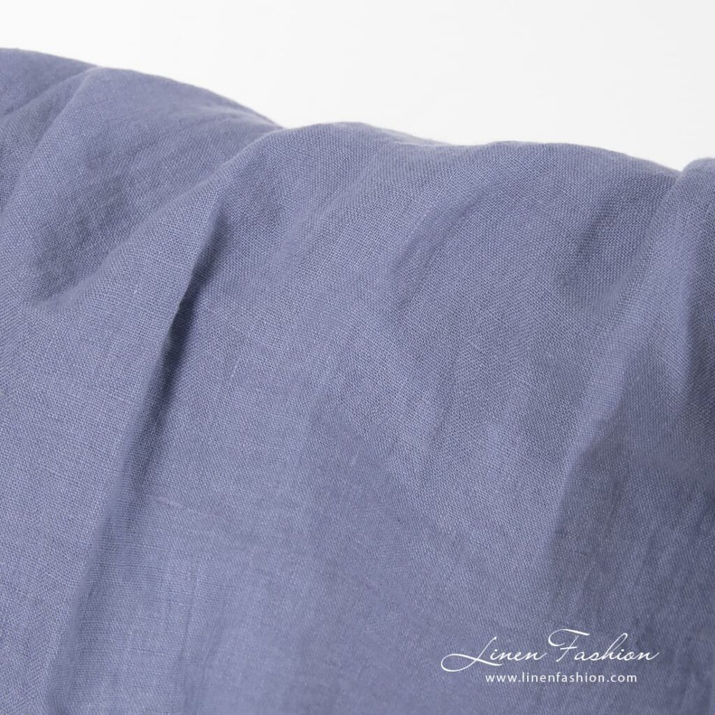 Washed 100% linen fabric in dusty blue.