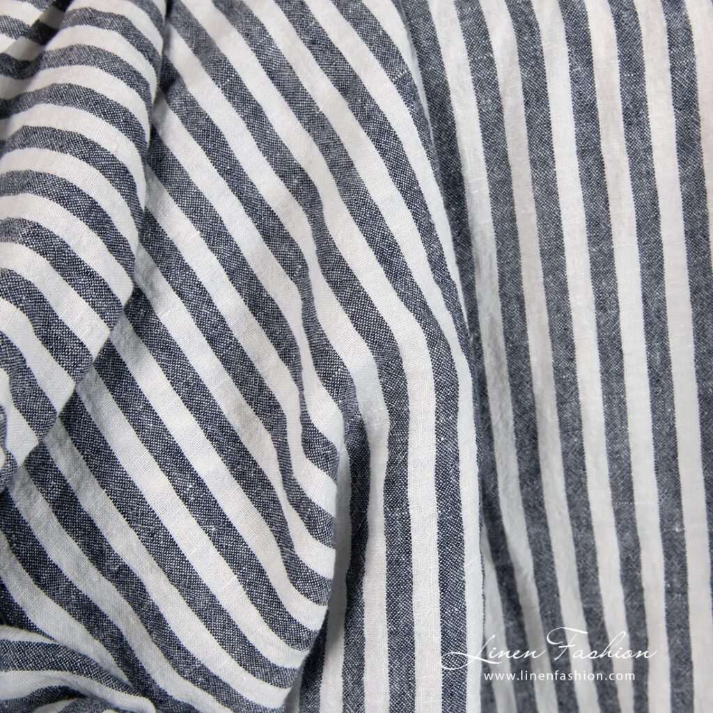 Wide linen fabric in blue stripes, specially washed to increase softness