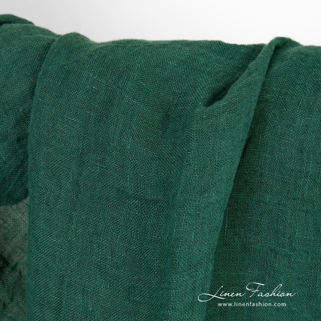 Transparent forest green linen fabric
