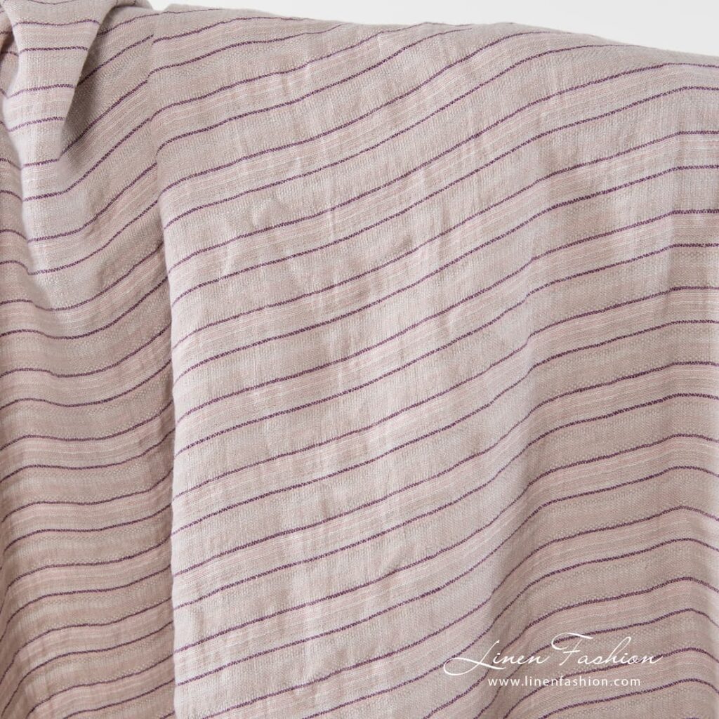 Washed 100% linen fabric in ash and pastel pink.