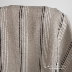 Grey brown linen fabric in stripes, specially washed to increase softness
