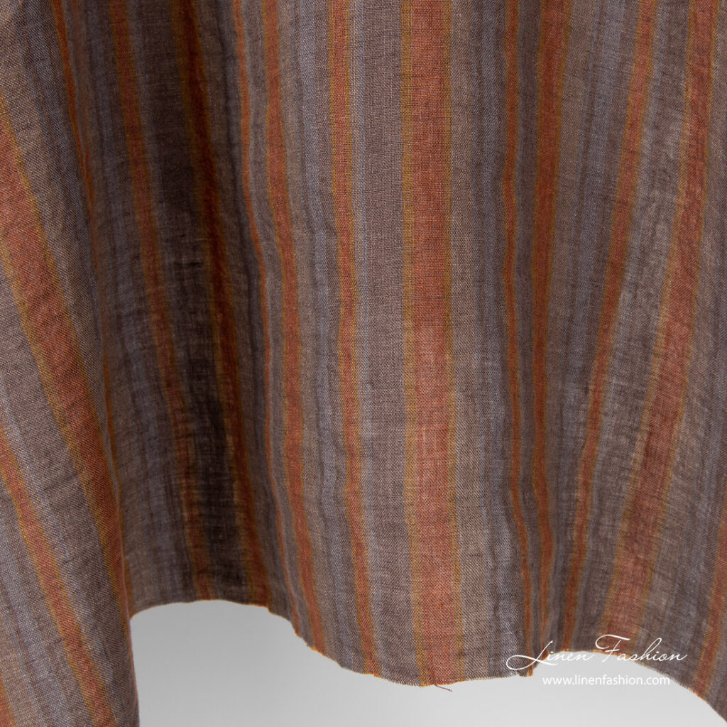Variable brown and grey stripe width linen fabric, washed