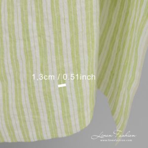 Light green linen fabric in stripes, perfect for clothes and home textile