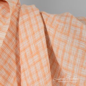 Jacquard linen fabric in orange checks, washed