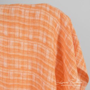 Orange jacquard linen fabric, washed