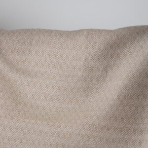 Brown and white linen cotton fabric in a herringbone pattern close up detail