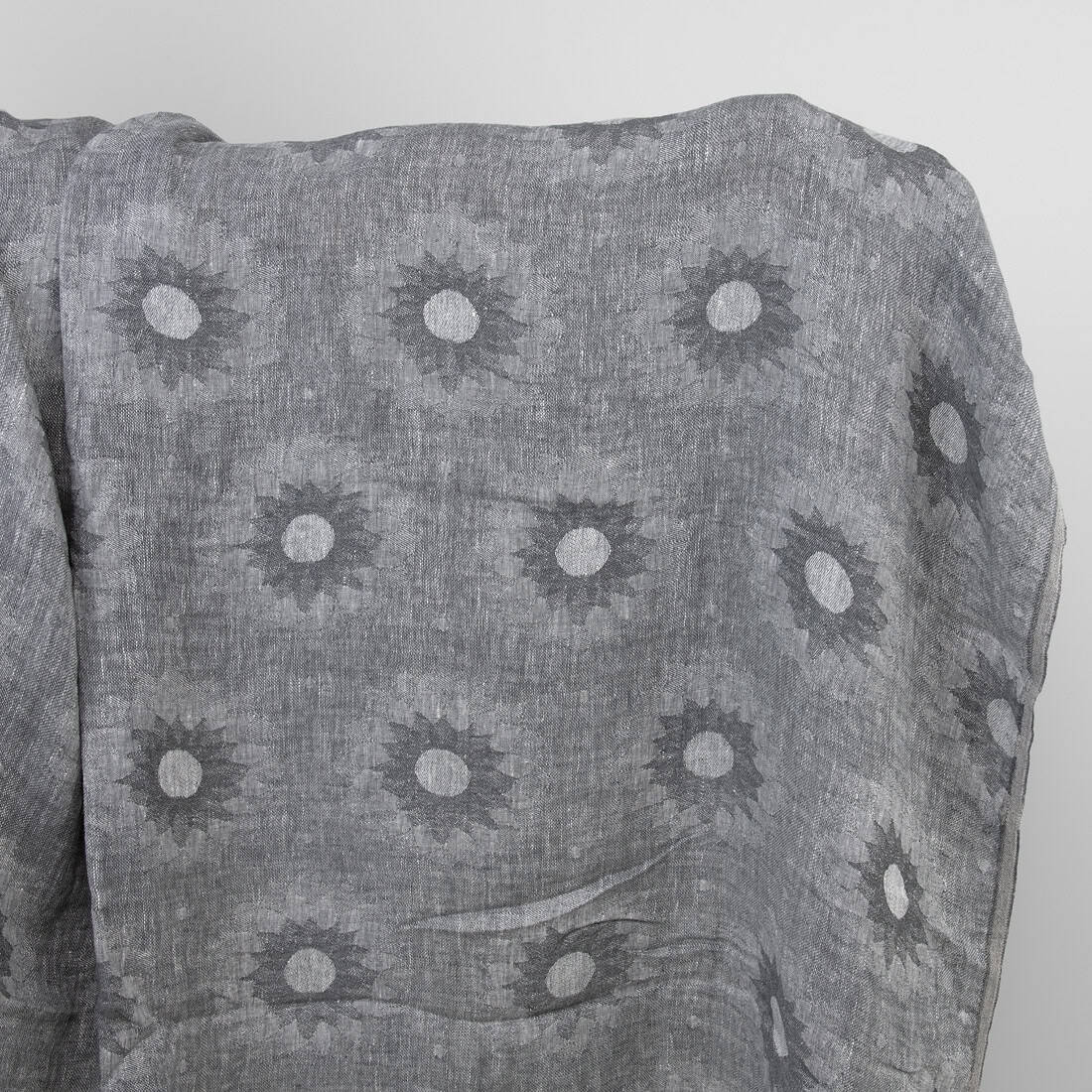 Grey linen fabric with floral pattern washed