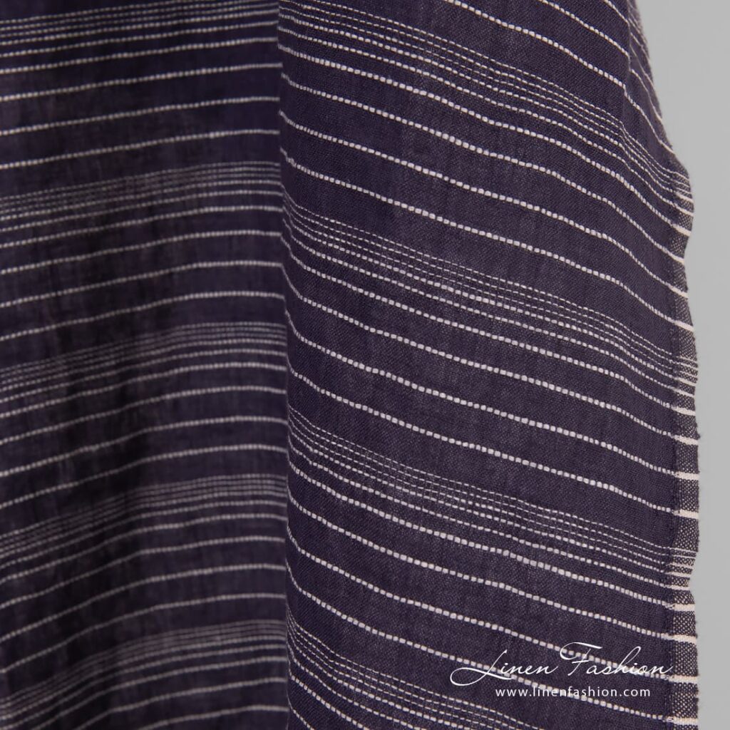 Dark blue linen fabric in stripes, specially washed to increase softness
