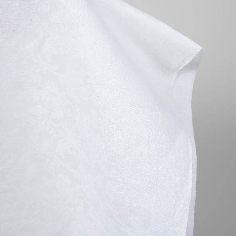 Optical white linen cotton fabric with flower ornaments edge