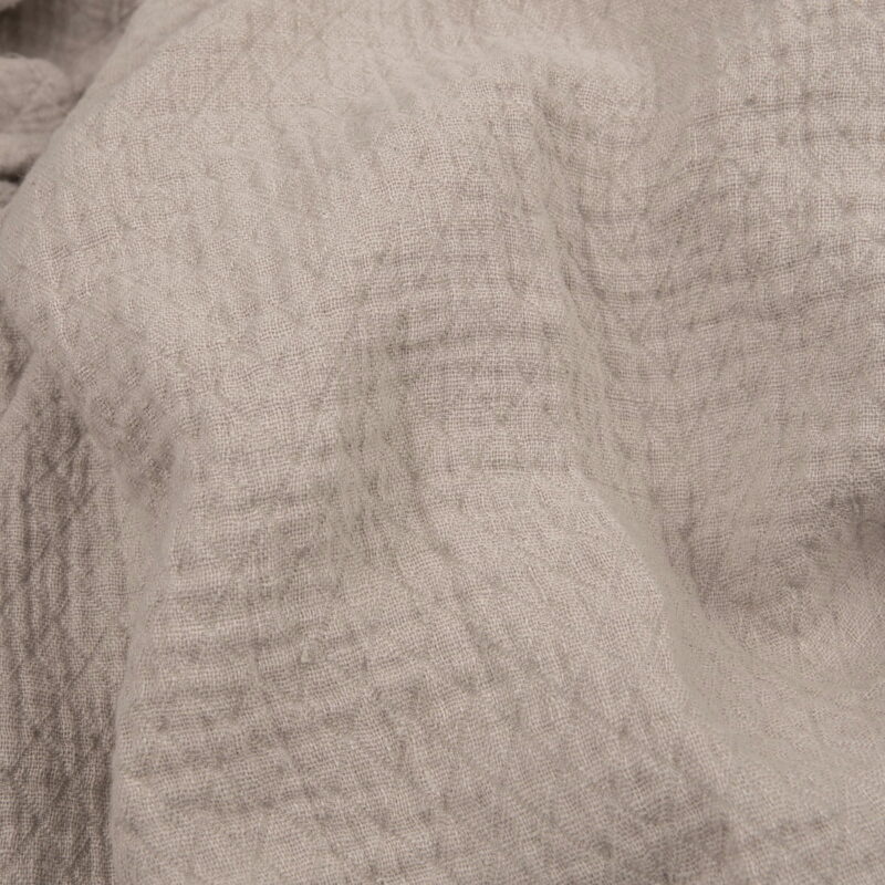 Light grey linen fabric with a diamond pattern washed