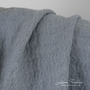 Bluish grey jacquard linen fabric in zigzag pattern, specially washed to increase softness