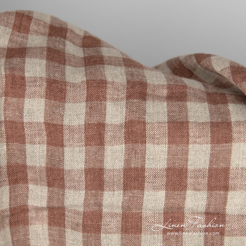Washed linen fabric brown and natural checks close up detail