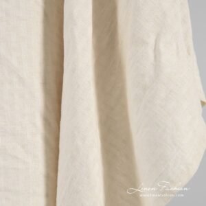 Linen cotton fabric in patterned stripes that forms checks