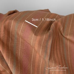 Dark brown stripes woven in diagonal lines that gives to the fabric a certain vibrancy and radiance