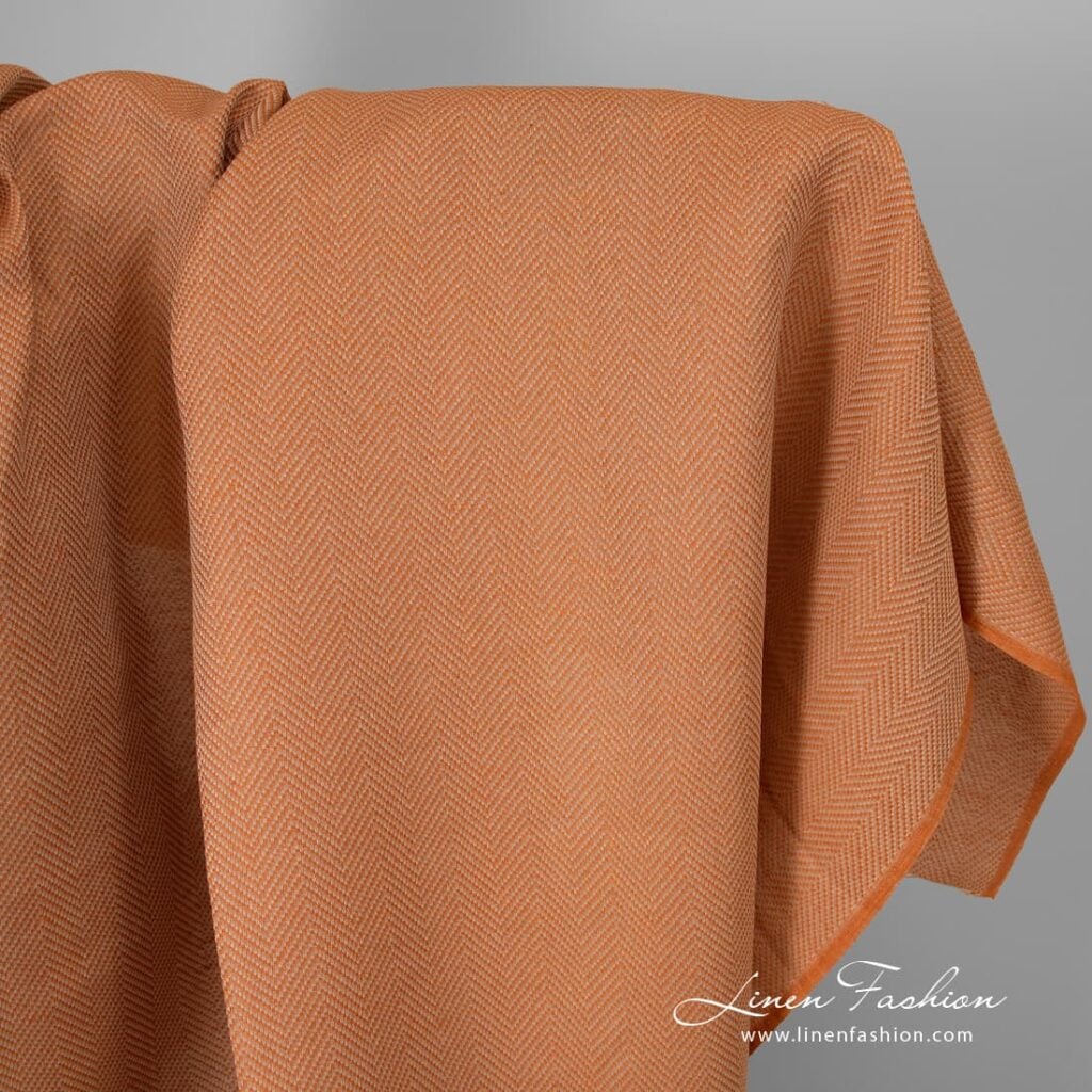 Orange linen cotton fabric in herringbone.